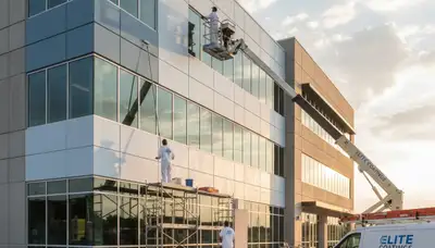 Professional commercial painters finishing an office exterior in Baltimore, MD