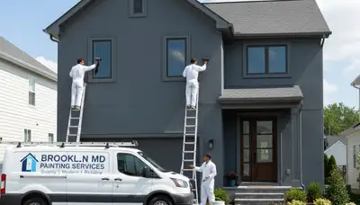 Professional house painters working on exterior home in Baltimore, MD