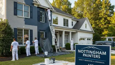 Professional house painters applying exterior paint on a Baltimore MD home